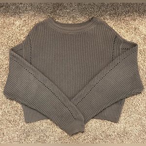 Oversized, grey sweater. Very comfortable.